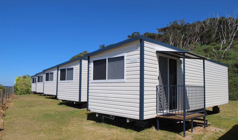 Transportable cabins located along the coastline of NSW at a caravan home